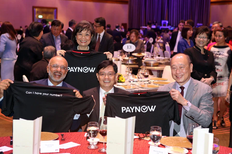 From left: DBS chief executive Piyush Gupta, Association of Banks in Singapore director Ong-Ang Ai Boon, then-finance minister Heng Swee Keat and UOB chief executive Wee Ee Cheong in 2017 at the launch of PayNow.

