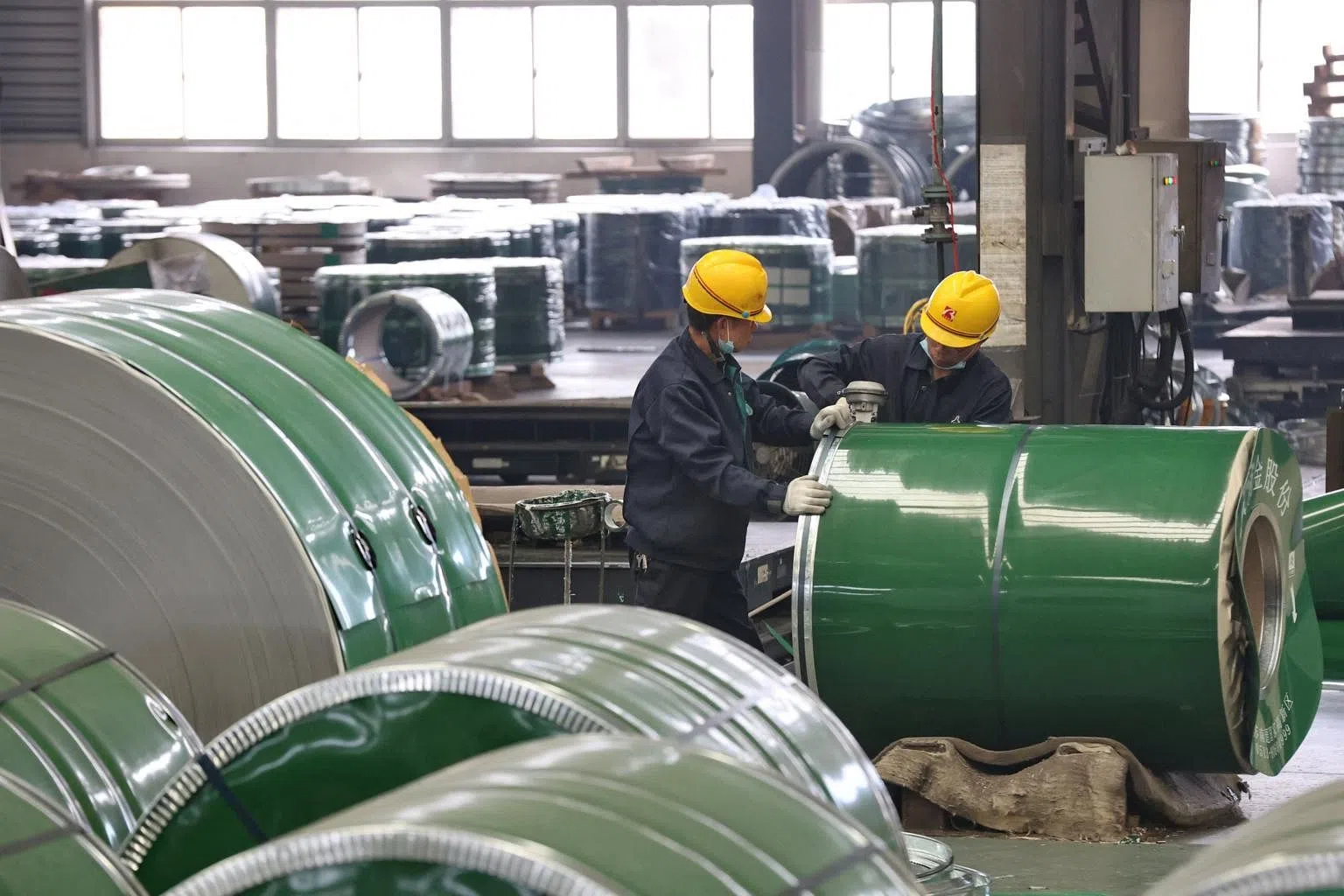 China Feb factory inflation eases, spotlight on global commodities