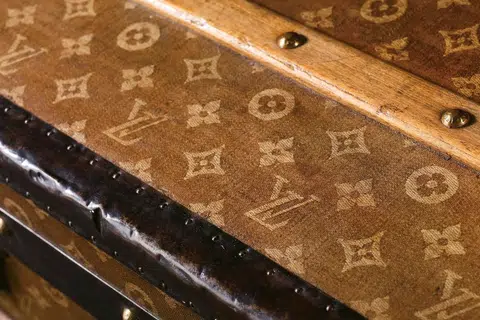 The iconic monogram on an 1897 trunk.