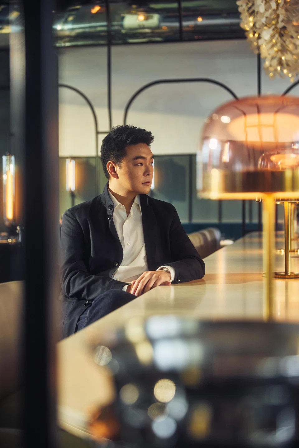 Until recently, Zach Lee has stayed under the radar. He wears a shirt from Boss, and overshirt and jeans from Zegna.