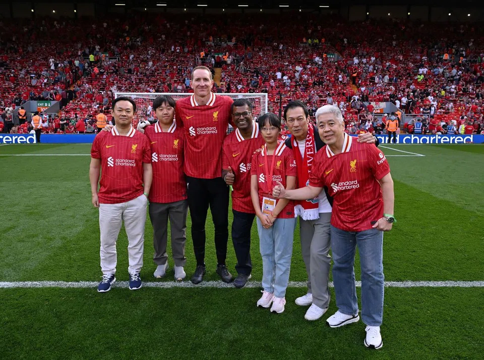 A group of StanChart clients, accompanied by the bank's Global and Singapore International Banking head James Lye (second from right), had a chance to take penalty kicks against ex-Liverpool goalkeeper Chris Kirkland (third from left) at Anfield on May 11.
