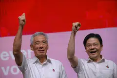 Prime Minister Lee Hsien Loong (left) and his successor Deputy Prime Minister Lawrence at the People's Action Party Awards and Convention in November 2023.
