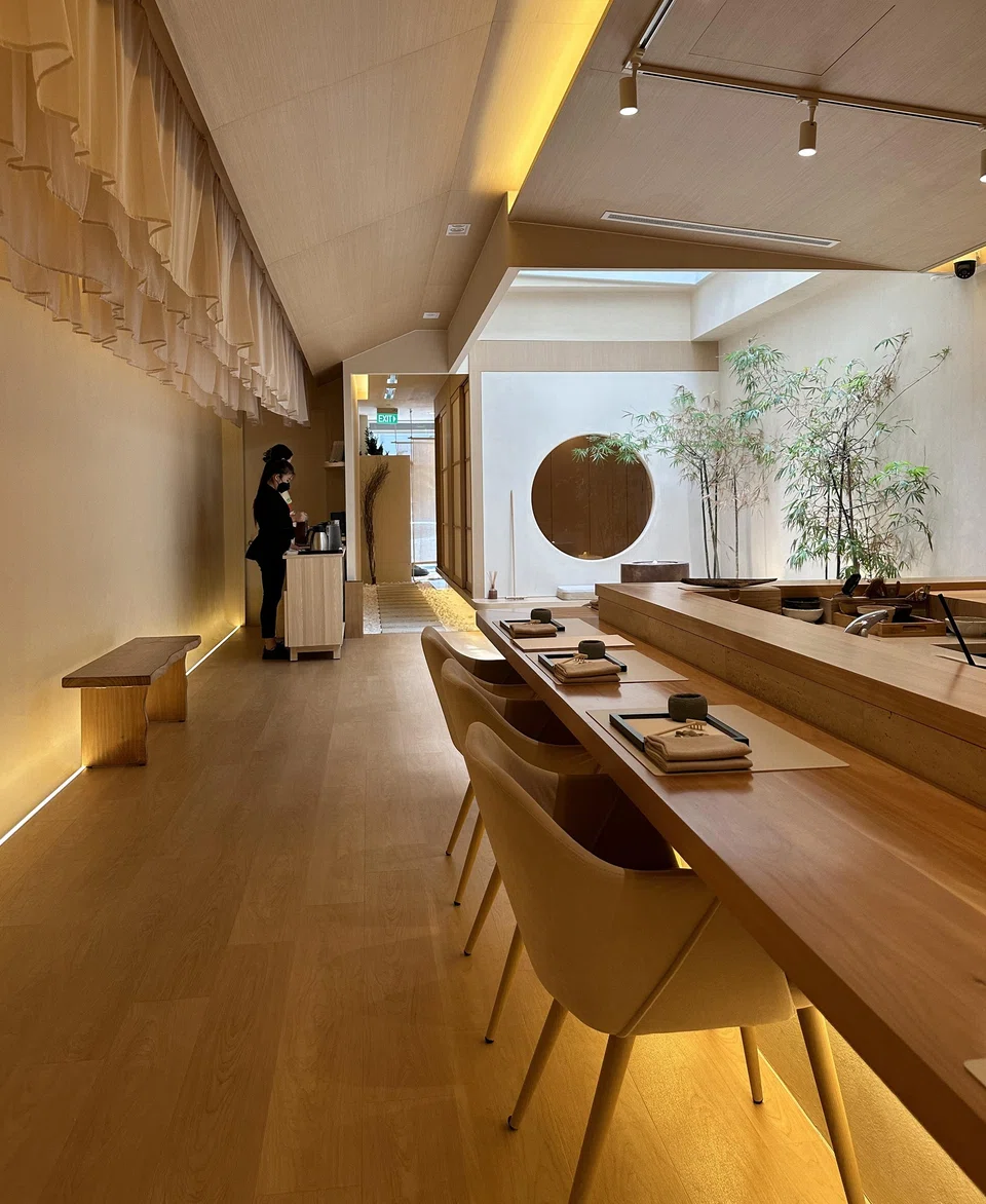 The restaurant features an indoor zen garden in the middle.