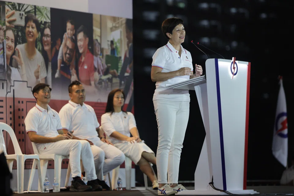 Minister in the Prime Minister’s Office Indranee Rajah speaking at a rally on Apr 28. Seated behind her are the rest of PAP's Pasir Ris-Changi slate (from left): Desmond Tan, Sharael Taha and Valerie Lee.