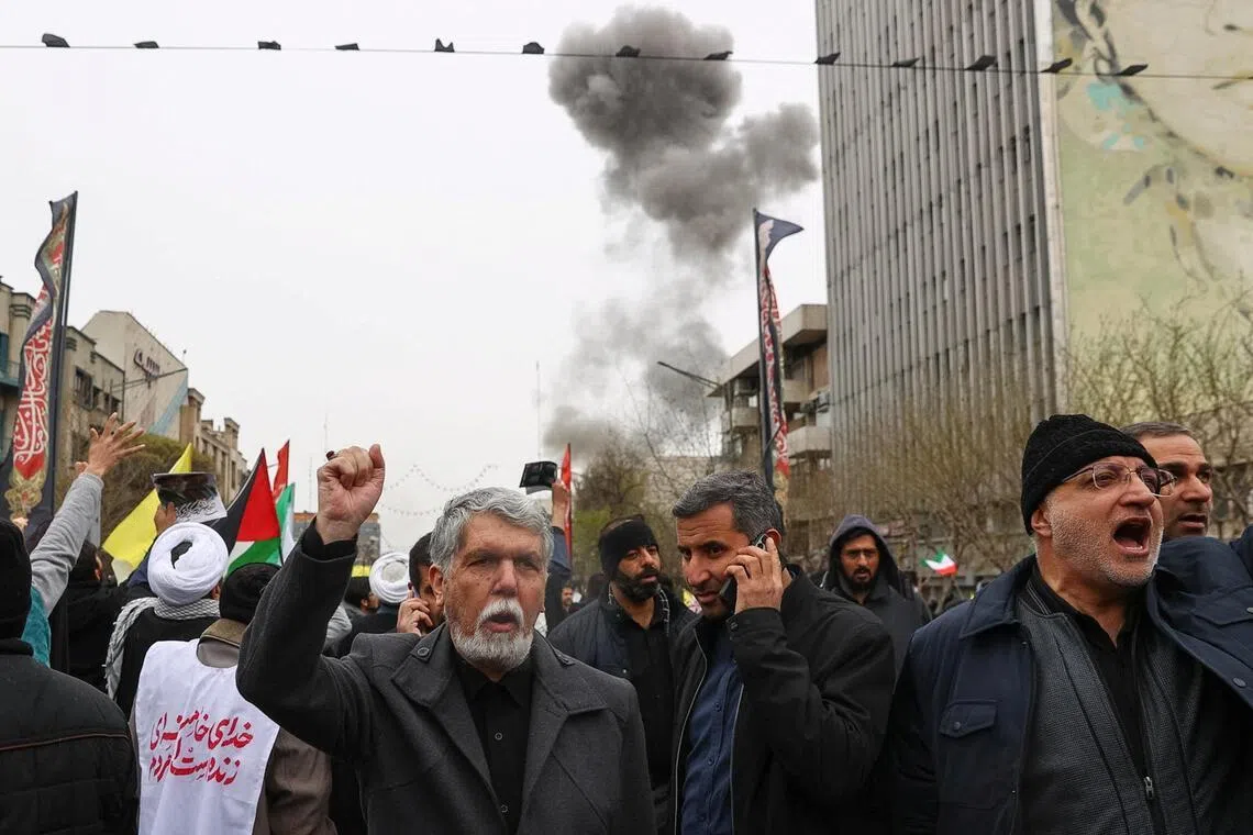 Smoke rises following an explosion during a protest marking the annual al-Quds Day (Jerusalem Day) on the last Friday of the holy month of Ramadan in Teheran, on Mar 13.