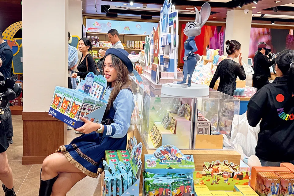 A local influencer dresses up as a character from the animated movie “Zootopia” as she poses for a photo on Oct 25 at the first Miniso Land store in Thailand. 