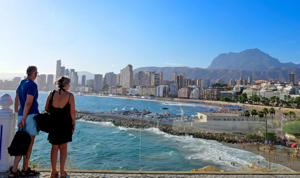 A former seafaring village of whitewashed houses and just 3,000 residents, Benidorm has mushroomed into a city of more than 100 skyscrapers whose population swells to 400,000 on peak August days.