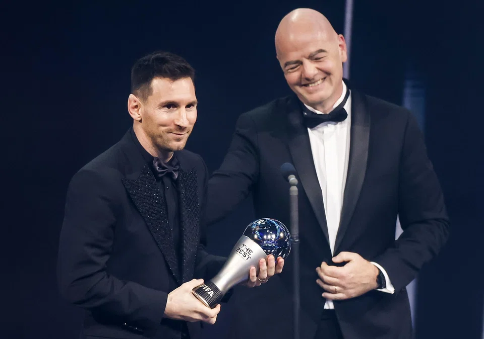 Argentina's Lionel Messi with his Best Fifa Men's Player Award next to Fifa President Gianni Infantino on stage during an ceremony in Paris, France, Feb 27, 2023.  