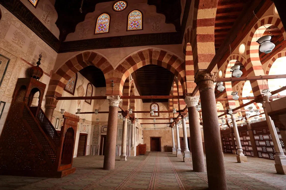 The mosque’s main entrance is decorated in ornate inscriptions and fine marble.