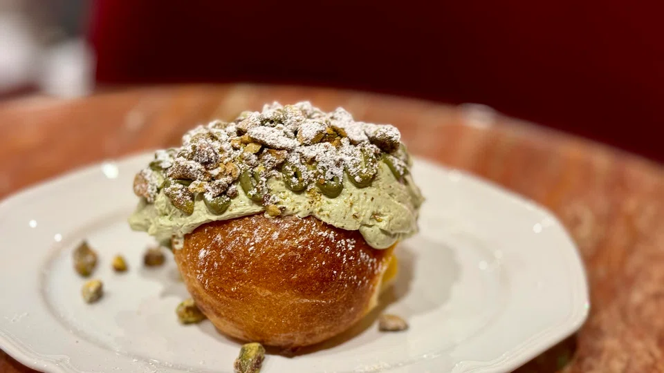 Maritozzi is a brioche bun stuffed with pistachio cream.