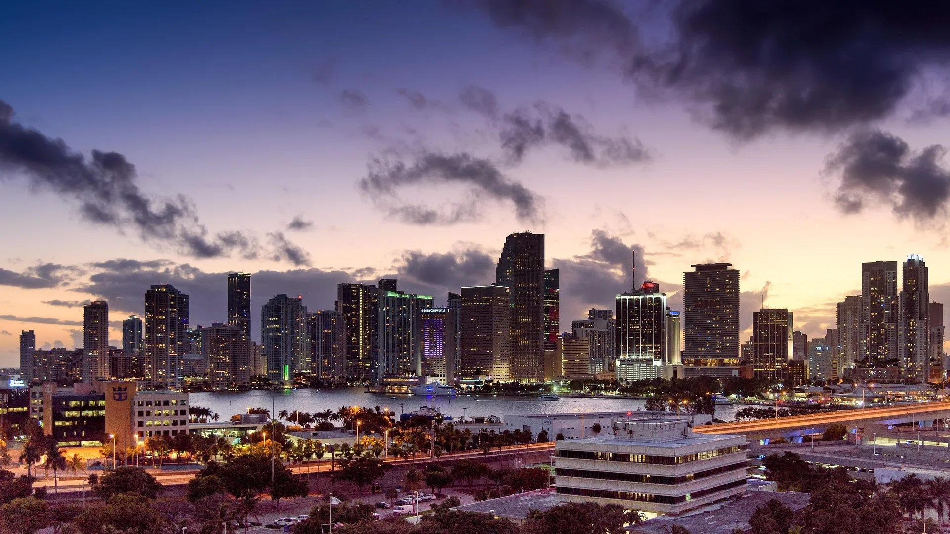 A New York couple purchases a high-end penthouse in Miami's St Regis, showcasing the city's luxury real estate boom