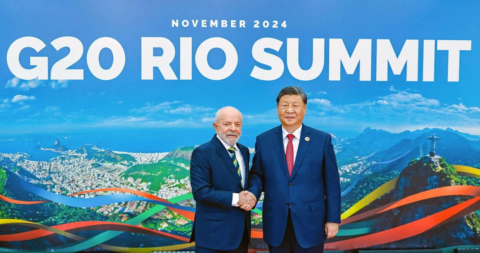 (From left) Brazil's President Luiz Inacio Lula da Silva shaking hands with China's President Xi Jinping at the G20 summit in Rio de Janeiro, Brazil, Nov 18, 2024. 