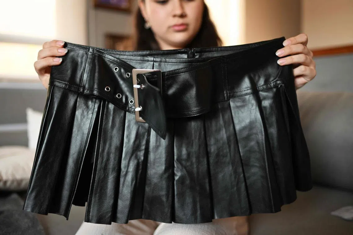 Isidora Olave, 20, showing her order from fast fashion e-commerce company Shein in Santiago, Chile, Nov 12, 2024. Ultra-cheap Chinese online shops are causing concern in Latin America because of the unfair competition they pose to traditional commerce. 