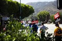 Striking members of the Writers Guild of America picket outside Walt Disney Studios in Burbank, California on Aug 3, 2023.