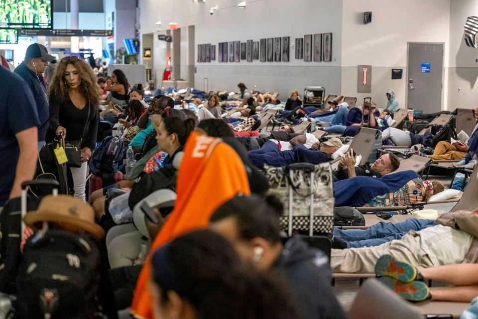 Stranded travellers at George Bush Intercontinental Airport in Houston, Texas, on Jul 20, after a widespread global computer outage grounded planes and created chaos at airports. 
