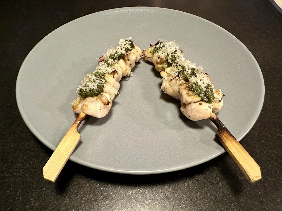 Frog's leg skewers with laksa leaf pesto.