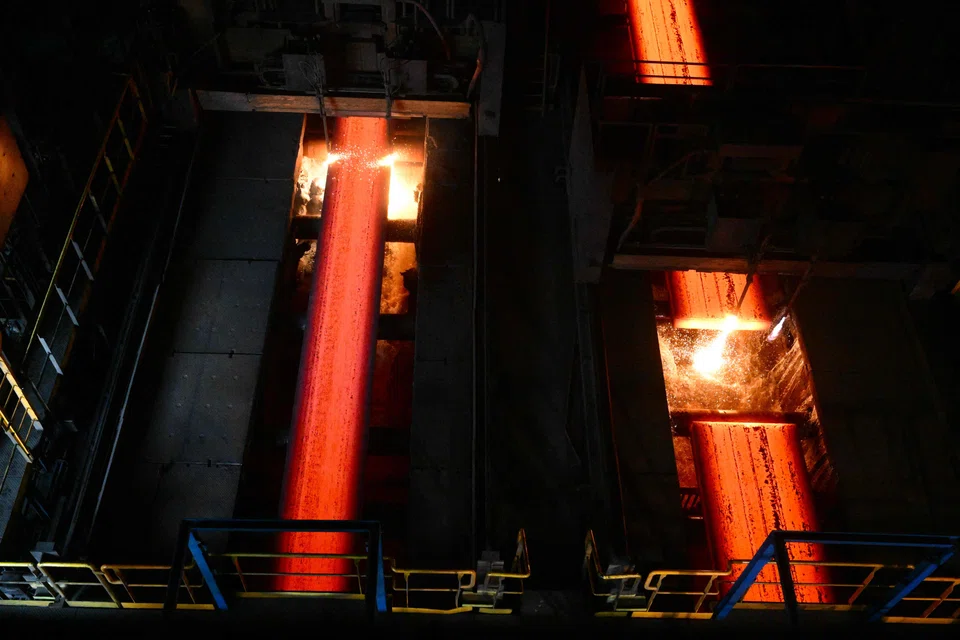 This photograph taken on February 22, 2023, shows a part of a steel production line inside the steelwork site of an ArcelorMittal factory, as the site goes through a plan to reduce its carbon footprint (CO2) up to 35 percent for 2030, in Fos sur mer. - ArcelorMittal will reoperate one of the two blast-furnaces that was stopped at the end of 2022 due to the reduction in steel demand and the impact of rising energy prices, announced the site's director on February 22, 2023. (Photo by Christophe SIMON / AFP)