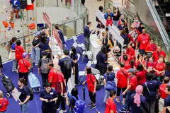 CapitaLand staff volunteers bringing seniors to reminiscence-themed booths at the #LoveOurSeniors carnival at Kallang Wave Mall.  