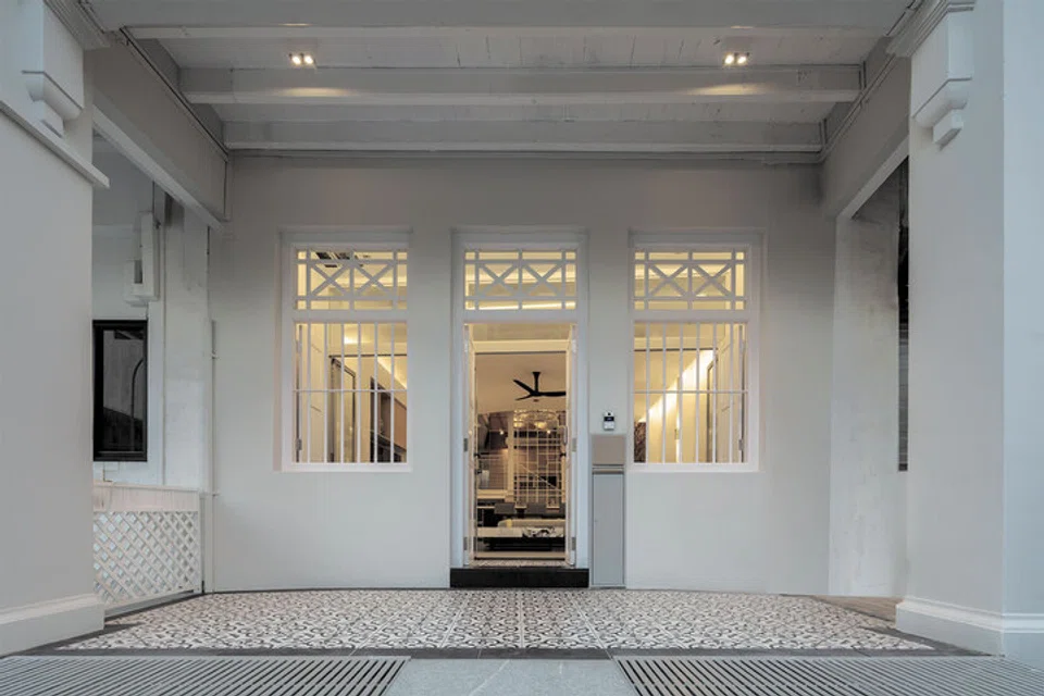 A layered entryway behind the main facade on the first storey.