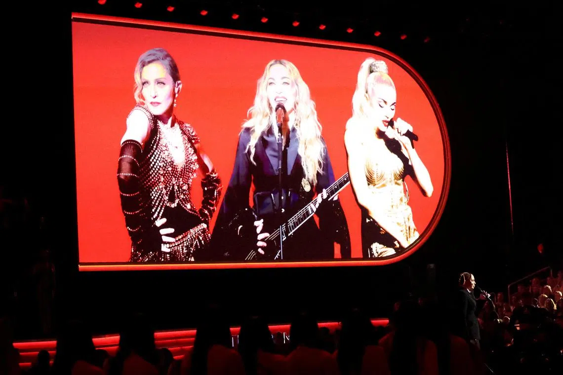 Madonna will have 24 onstage performers, four of her children will also be on stage, and she will be  transported high up around the arena “in an illuminated portal frame that acts as a time machine”.