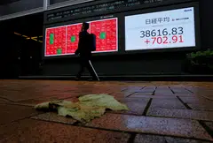 Japan's Topix Index rose about 1 per cent, boosted by the tech sector on the back of a record close for the Nasdaq Composite overnight. Shares in mainland China, Hong Kong and Australia fell.
