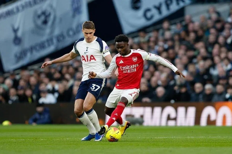 Micky van de Ven of Tottenham (left) in action against Bukayo Saka of Arsenal during their English Premier League match at the Tottenham Hotspur Stadium in London on Feb 22.