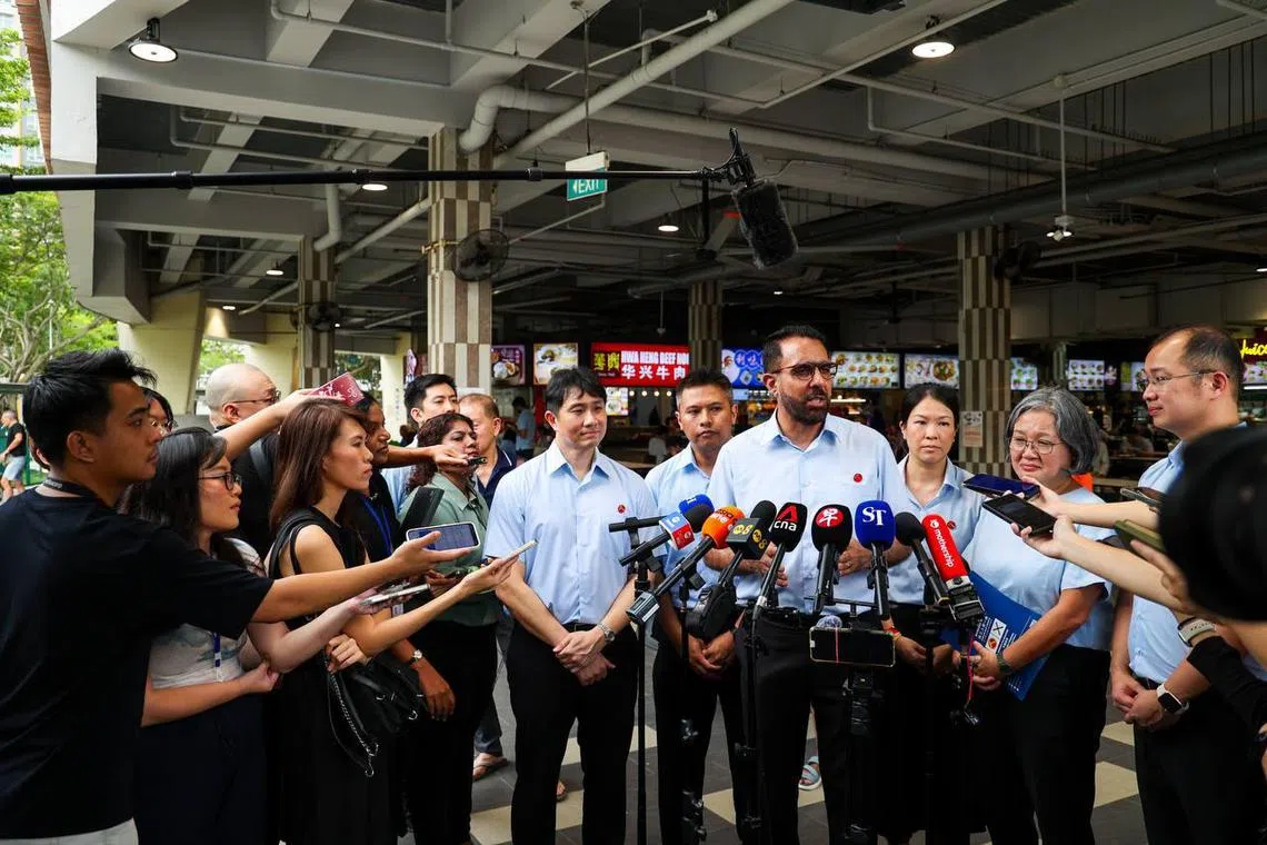 The Workers' Party spoke to reporters after a walkabout in Sengkang. Present were (from left) Jamus Lim, Abdul Muhaimin Abdul Malik, Pritam Singh, He Ting Ru, Sylvia Lim and Louis Chua.