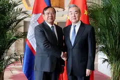 China's Foreign Minister Wang Yi (right) with Cambodia's Deputy Prime Minister Prak Sokhonn, who is also the country's foreign minister. Wang calls the ceasefire "an important step towards restoring peace".