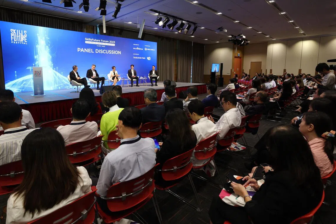 (From left) SkillsFuture Singapore chief executive Tan Kok Yam, Institute for Human Resource Professionals CEO Aslam Sardar, Microsoft Singapore’s managing director Lee Hui Li, DITP’s CEO Lee Kian Chong and The Business Times’ associate editor for product Christopher Lim taking part in a panel discussion at the SkillsFuture Forum on 4 July 2023.
