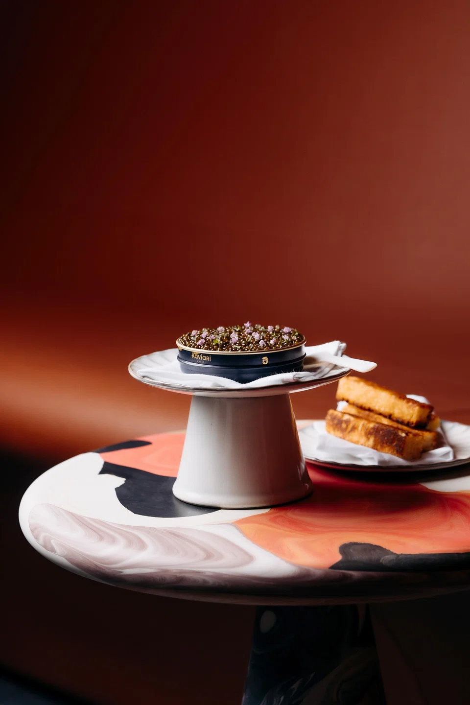 Langoustine, foie gras and caviar are served in a dainty tin with toasted brioche.