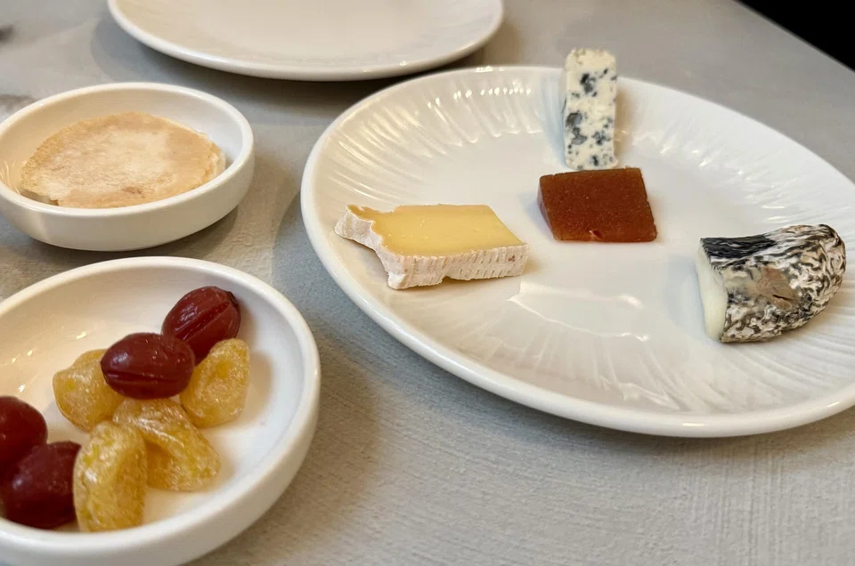 Assorted cheese, home-pickled grapes and preserved kumquats. 