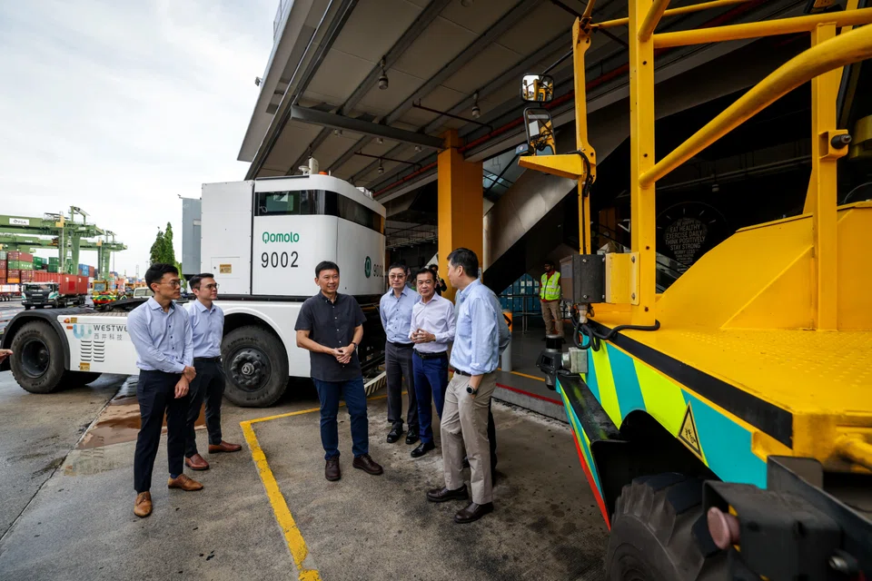 Transport Minister Chee Hong Tat (third from left) announced a 6.1% year-on-year jump in shipping containers handled by PSA Singapore from January to April this year, during a visit to PSA's Pasir Panjang Terminal.