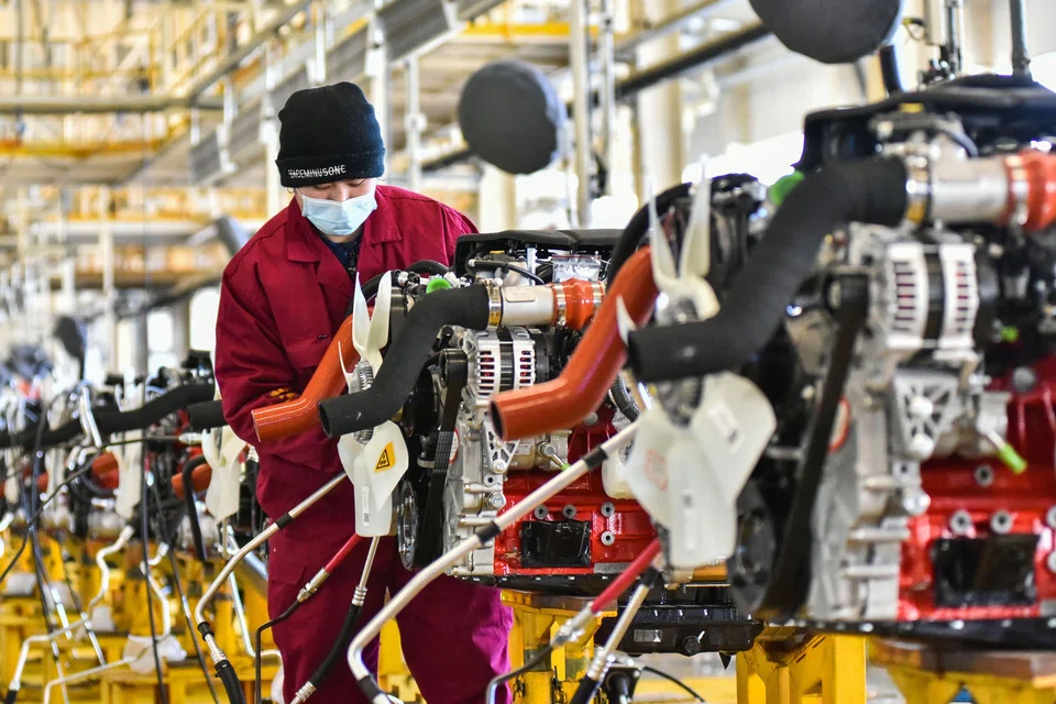 An employee at a JAC Automotive factory in Qingzhou, in China's eastern Shandong province on Jan 31. China’s recovery is expected to be supported by domestic consumption, which is set to recover from a very low base.