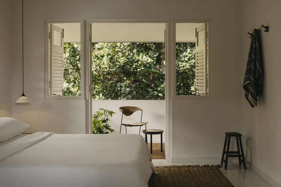 The master bedroom was stripped bare and sparsely furnished to align with the rest of the apartment,