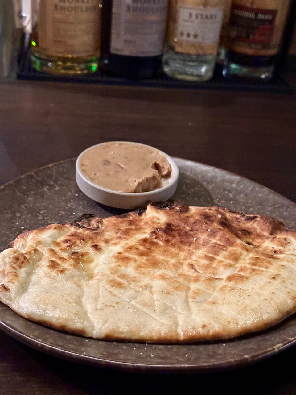 Chunky flatbread served with miso butter.