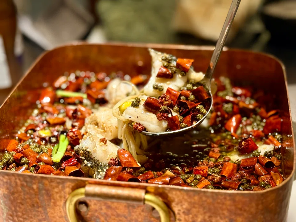 Spicy fish and pig intestines in chilli oil.