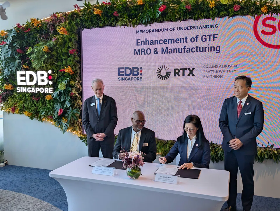 Pratt & Whitney's senior vice-president of commercial engines operations Robert Griffiths (left, seated) and executive vice-president of EDB Cindy Koh at the MOU signing ceremony at Singapore Airshow 2026.