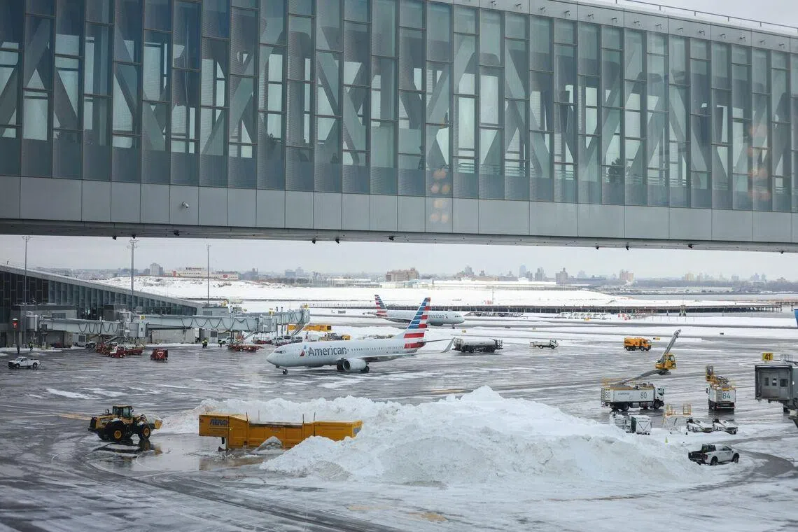 Above: LaGuardia Airport in New York on Monday (Jan 26). The potential cost of the winter storm is likely to be front of mind for investors when American Air and JetBlue Airways report fourth-quarter earnings this week.