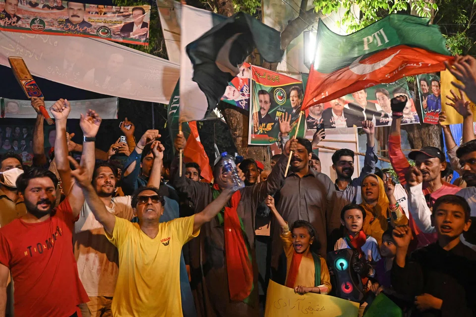 Supporters of former Pakistan's Prime Minister, Imran Khan, gather at Zaman Park in Lahore. Khan’s ouster in April last year has galvanised support for the former international cricket star as the unsteady coalition that replaced him struggles to pull Pakistan back from the brink of default and control spiralling inflation.