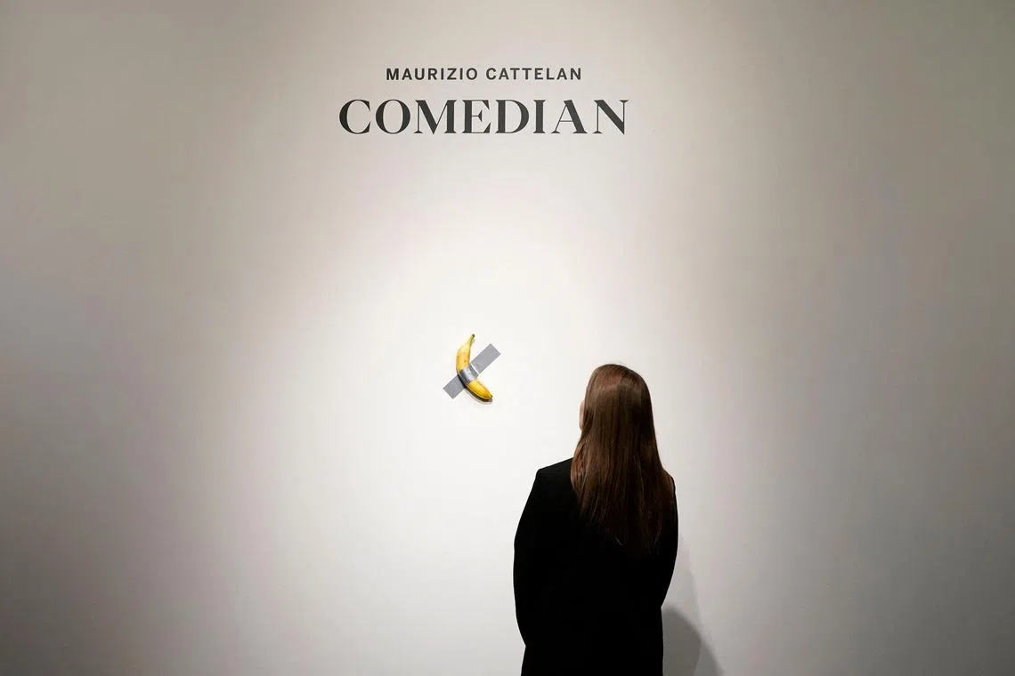A visitor ate the banana that was part of Maurizio Cattelan's work "Comedian", estimated at several million euros and presented in the exhibition "Dimanche sans fin" at the Centre Pompidou in Metz, France, July 18, 2025. 