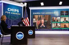 US President Joe Biden said government backing for domestic semiconductor producers means the United States will “be able to stay in the game.”