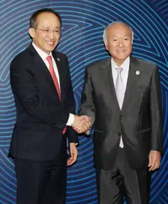 South Korean Finance Minister Choo Kyung-ho (L) and Japanese Finance Minister Shunichi Suzuki  meeting on the sidelines of this year's annual congress of the Asian Development Bank in Incheon, South Korea.