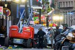 Earlier on New Year’s Day, a truck ploughed into a crowded street in New Orleans (top), killing 15 people, and in Las Vegas, a Tesla truck exploded outside a Trump hotel in Las Vegas, killing one person and injuring seven others.