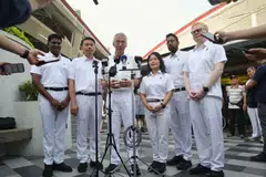 Senior Minister Lee Hsien Loong and the PAP Aljunied GRC candidates at 630 Bedok Reservoir Road Market and Food Centre on Apr 29.