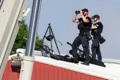 Secret Service snipers stand watch before a former President Donald Trump campaign event in Butler, Pennsylvania, July 13, 2024. The shooter, Thomas Matthew Crooks, 20, was shot dead by snipers after attempting to assassinate Trump.