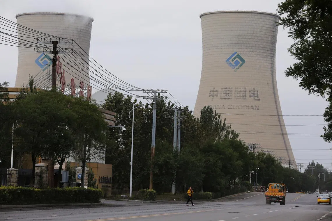 A file photo from 2021 of a China Energy coal-fired power plant in Shenyang. Power generation companies are currently the only firms trading on China's national carbon market.