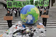 Environmental activists lobbying against plastic pollution on Earth Day in April 2024 in Seoul. One way to rein in the problem of solid waste is to adopt a circular economy model, which aims to develop a system of production and consumption involving prolonging the lifecycle of products. 