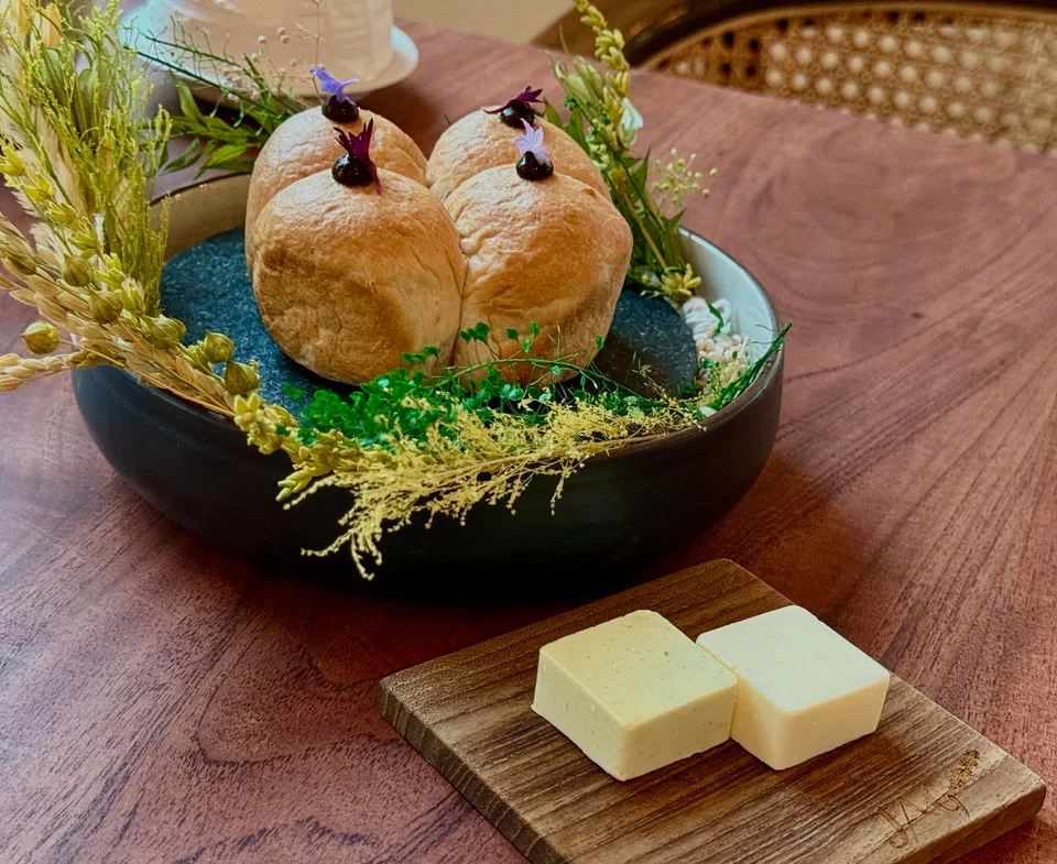 Homemade bread topped with black garlic paste.