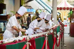 Chefs setting up the 93.1-m-long stollen on Wednesday.