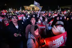 Demonstrators call for the impeachment of President Yoon Suk Yeol outside the National Assembly in Seoul, South Korea, Dec 7, 2024. 
